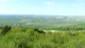 Im Nordwesten Haselbach (links) und im Hintergrund erstrecken sich Schwarz- und Glasweiner Wald.